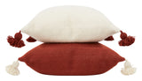 Bashir Floor Cushions, crafted from hand-spun, hand-dyed wool on traditional wooden looms in Morocco, feature a hidden zipper closure, a plush down and feather pillow insert, and charming pom-pom tassels in contrasting hues of ivory and Bordeaux.