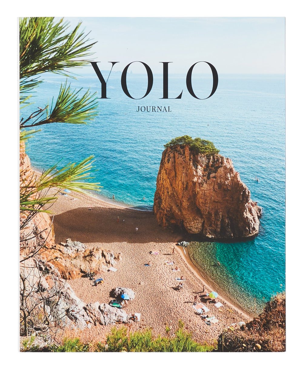 The latest issue of Yolo Journal, curated by Yolanda Edwards, offers travel inspiration with beautiful photography and stories about Spain's best destinations, including Mallorca, Cadaques, Galicia, Ibiza, and Pamplona, as well as recommendations for hotels, festivals, and Spanish fare.